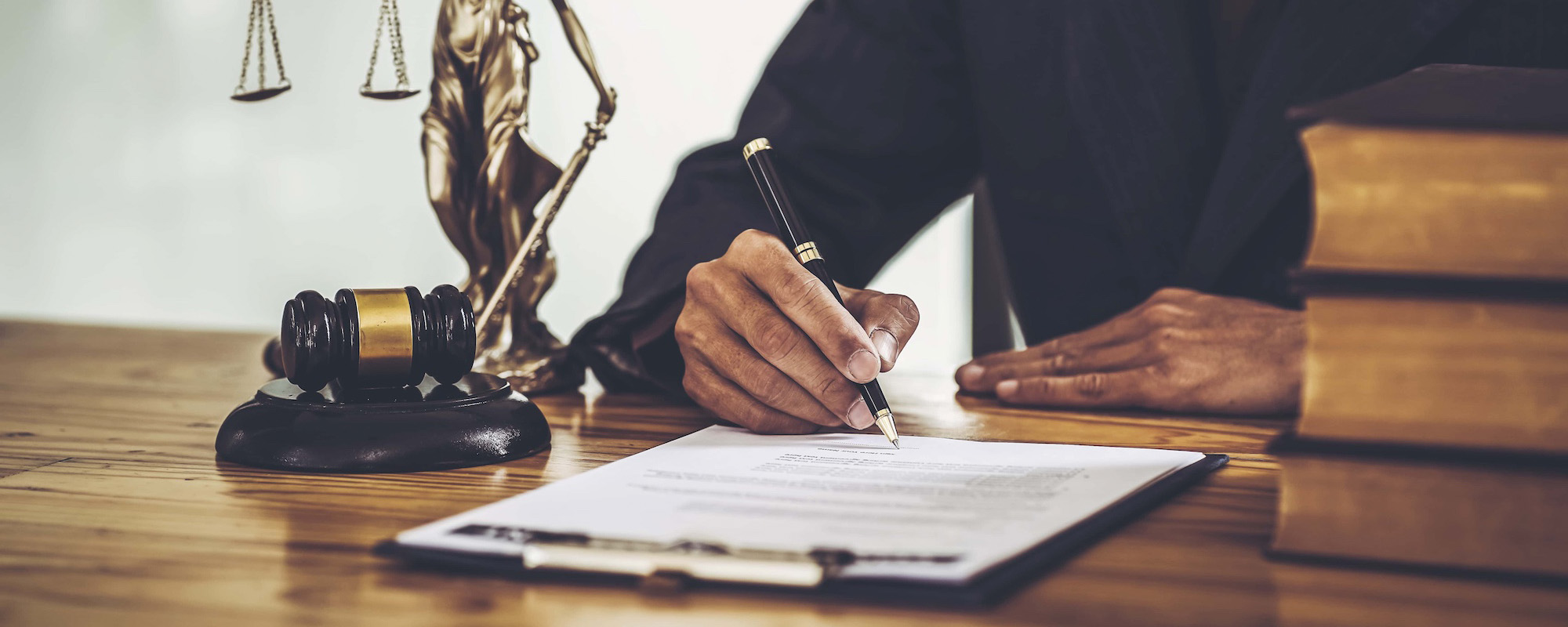 Attorneys sign legal contract documents. while sitting in a private office