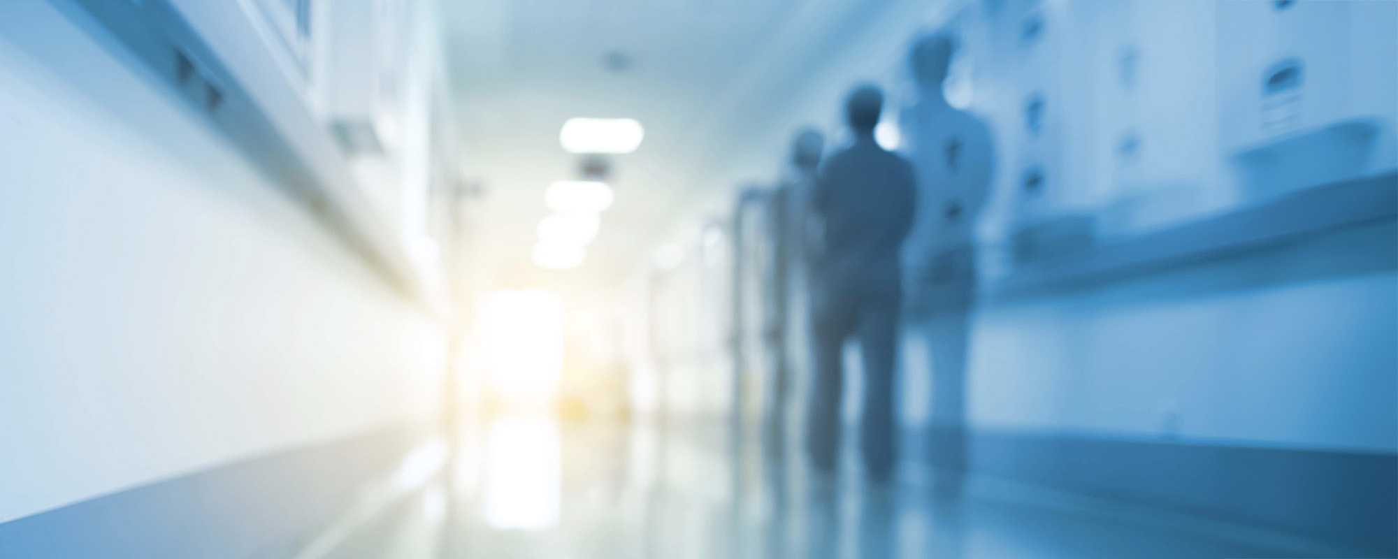 Doubled silhouette of medical worker in hospital hall unfocused background