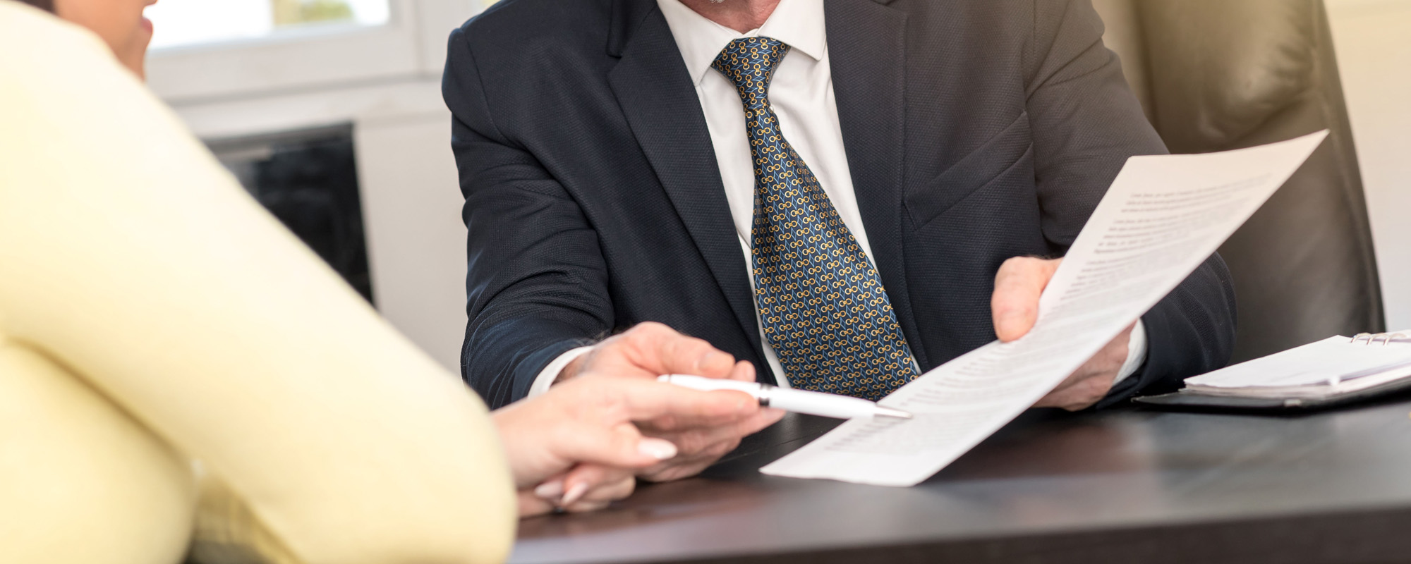 Woman meeting financial adviser in office light effect