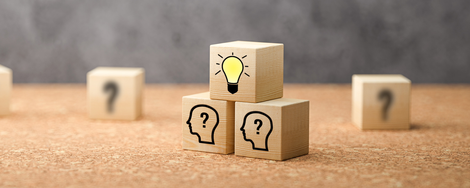 cubes showing a brainstorming session on concrete background