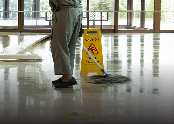 mopping wet floor in lobby hotel
