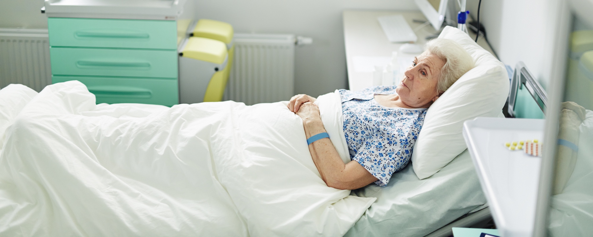 lady in bed with pressure ulcers